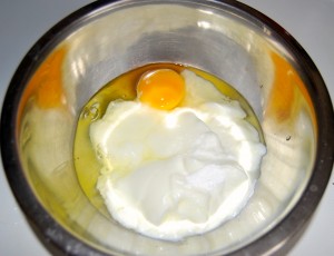 Mix egg with yogurt and sugar